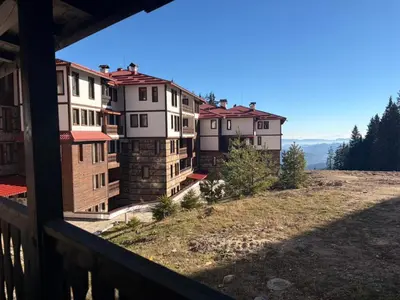 a view of a group of houses on a hill at Апартаменти Pamporovo Dream в Гранд Ризорт Пампорово in Pamporovo