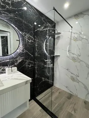 a bathroom with a shower and a sink at Center Park Apartment in Sandanski
