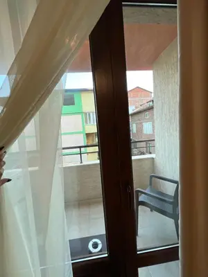 an open door to a balcony with a window at Victoria apartment - Sandanski in Sandanski