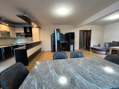 a living room with a large table and chairs at Victoria apartment - Sandanski in Sandanski