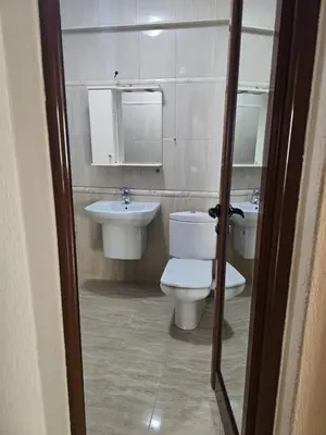 a bathroom with a toilet and a sink at Victoria apartment - Sandanski in Sandanski