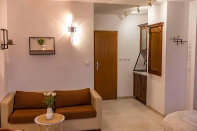a living room with a couch and a table at Flat in Bansko 5m walk to gondola in Bansko