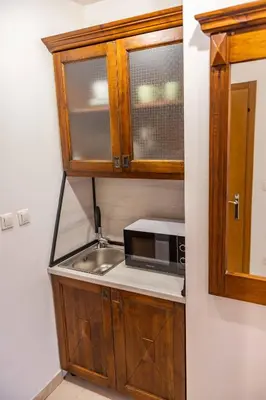 a kitchen with a sink and a microwave at Flat in Bansko 5m walk to gondola in Bansko