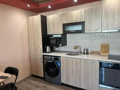 a kitchen with a washer and a sink and a dishwasher at Heart of Pernik apartment 2 in Pernik