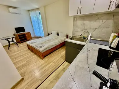 a kitchen with a bed and a sink in a room at MK Studios Krustova Vada plus Parking!!! in Sofia