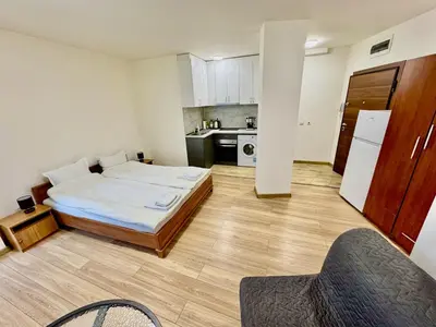 a small room with a bed and a kitchen at MK Studios Krustova Vada plus Parking!!! in Sofia