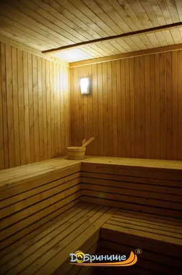a small wooden sauna with a toilet in it at Хотел Добринище in Dobrinishte