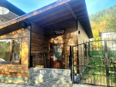 a house with a front door and a balcony at Къща за гости Джерман Guest house Dzherman in Sapareva Banya