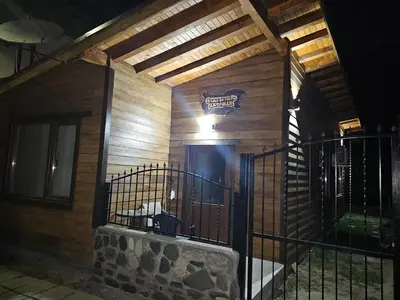 a house with a gate with a sign on it at Къща за гости Джерман Guest house Dzherman in Sapareva Banya
