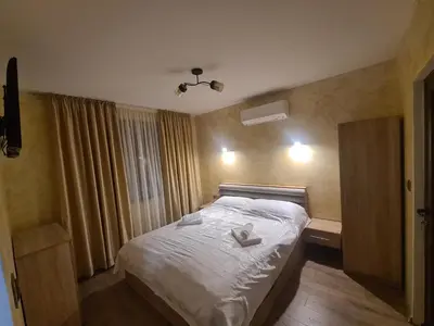 a bedroom with a bed with two hearts on it at Къща за гости Джерман Guest house Dzherman in Sapareva Banya