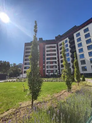 a large building with trees in front of it at DomBox Sofia Suites - Stylish 2 Bedroom in Center - Free Garage in Sofia