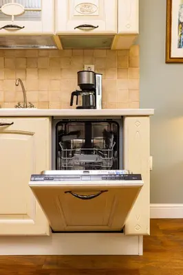 a kitchen with an appliance in an open dishwasher at 1BR Apartment in the Center with Free Street Parking and Designated Workspace in Plovdiv