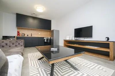 a living room with a couch and a table at Quiet & Comfy 1BR in the Heart of Plovdiv with Private Balcony in Plovdiv