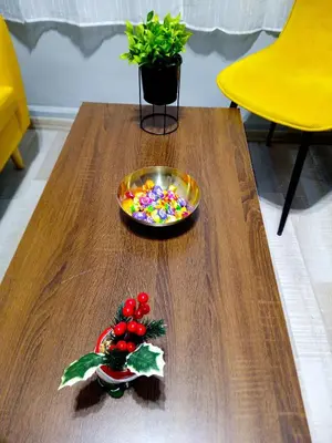 a wooden table with a bowl of candy on top of it at Industrial Art Studio - Top Center - plus Free Vouchers & Gift in Sofia
