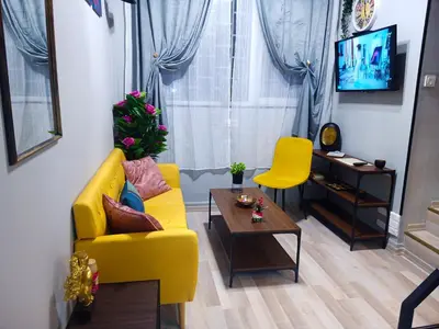 a living room with a yellow couch and a table at Industrial Art Studio - Top Center - plus Free Vouchers & Gift in Sofia