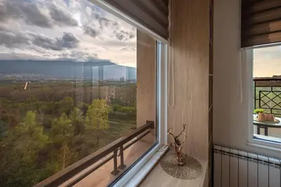 a room with a large window with a view at Brand New Luxury Apartments with Great Views in Sofia