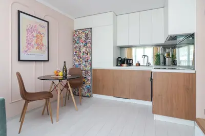 a kitchen and dining room with a table and chairs at Maison Colorée - Bright And Cozy Home by Metro And Mall in Sofia