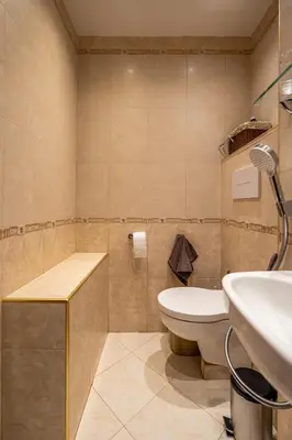 a bathroom with a toilet and a sink at Elegant Aristocratic 2 BDRM Flat, TOP Location in Sofia