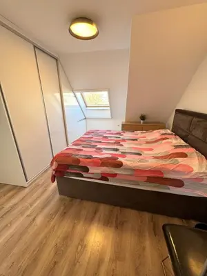 a bedroom with a large bed in a room at Cozy Home In Central Plovdiv in Plovdiv