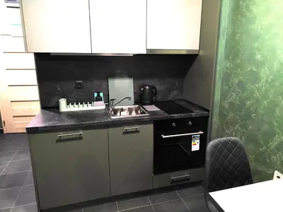 a small kitchen with a sink and a stove at RCR Einstein studios 3 in Sofia