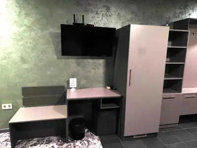 an office with a desk and a computer on a wall at RCR Einstein studios 3 in Sofia