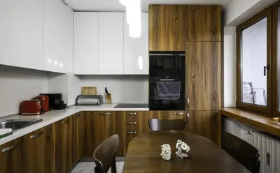 a kitchen with a table with chairs and a microwave at The Cosmopolitan Shine 1-BDR Pet-Friendly Flat in Sofia