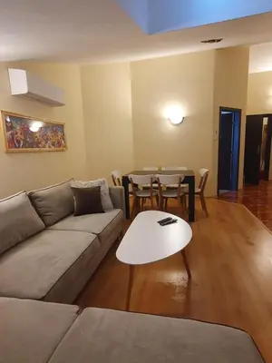 a living room with a couch and a table at Apartment Sunny in Pamporovo