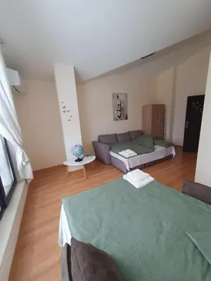 a large living room with a couch at Apartment Sunny in Pamporovo