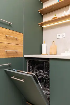 a dishwasher with a dish rack in a kitchen at Serene Living in the Heart of Plovdiv by Flat Mаnager in Plovdiv