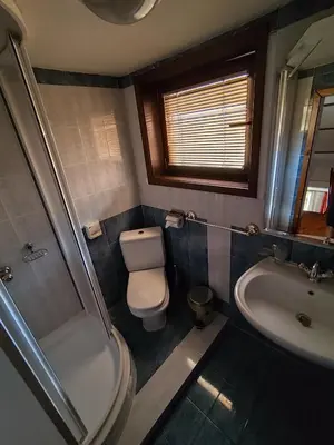 a bathroom with a toilet and a sink at Mountain View ECOVILLA in Devin