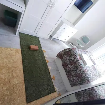 a living room with a couch and a table at NDK Central Home in Sofia