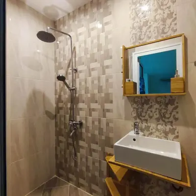 a bathroom with a sink and a shower at NDK Central Home in Sofia