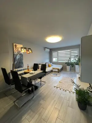 a living room with a couch and a table at Apartamento Estrella in Sofia