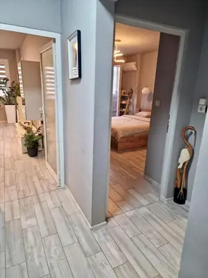 a hallway with a room with a bed and a mirror at Apartamento Estrella in Sofia