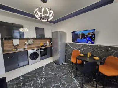 a kitchen with a table and a dining room at luxury Apartament TD one bedroom in Sofia