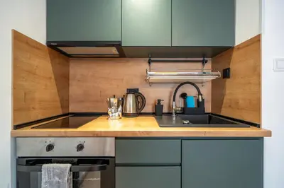 a kitchen with a sink and a stove at Exotic apartment in Sofia