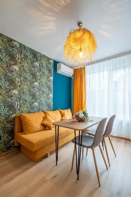 a living room with a couch and a table at Exotic apartment in Sofia