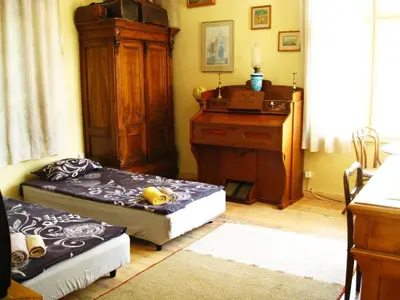 a living room with two beds and a desk at Apartment Mariza in Plovdiv