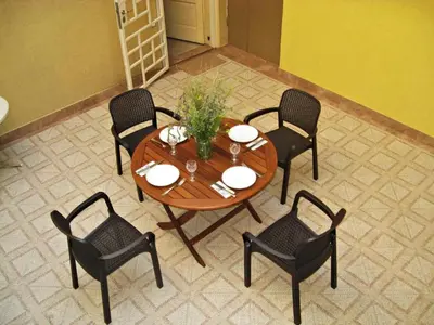 a wooden table with chairs and a tableasteryasteryasteryasteryasteryasteryasteryastery at Apartment Mariza in Plovdiv