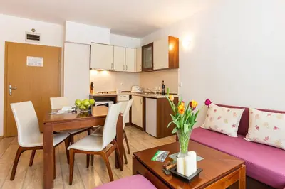 a living room with a couch and a table at Fantastic 1-bedroom apartment Stream Resort in Pamporovo