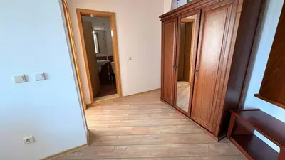 a hallway with two mirrors and a wood floor at Fantastic 1-bedroom apartment Stream Resort in Pamporovo