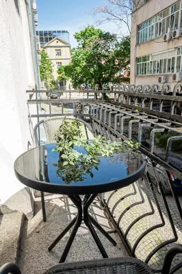 a glass table with a plant on top of it at Salts Market 3BR Retreat in Sofia