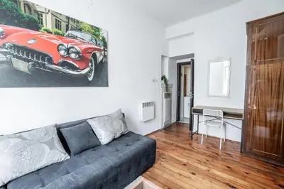 a living room with a red car on the wall at Salts Market 3BR Retreat in Sofia