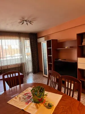 a kitchen and dining room with a table and chairs at Top-View Terrace 2BD Central Apt in Sofia