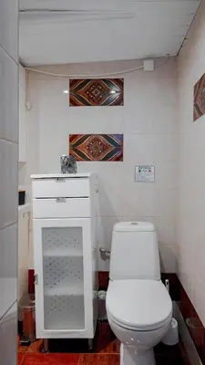 a bathroom with a white toilet and a sink at Central Cozy 1BD Compact Chic Living by Flat Mаnager in Sofia