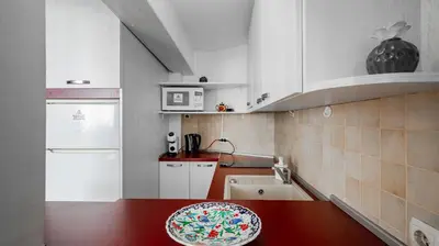 a kitchen with a counter and a plate on a table at Central Cozy 1BD Compact Chic Living by Flat Mаnager in Sofia