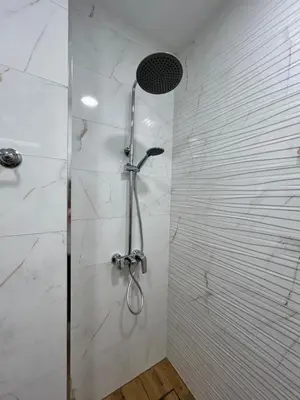a shower with a glass door in a bathroom at MirrArt House - Просторен луксозен апартамент - 3 спални - 2 бани - Топ център in Plovdiv
