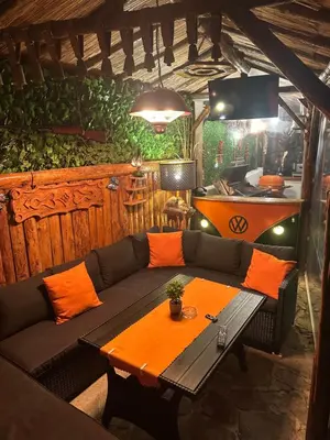 a living room with a couch and a table at Къща за гости Падалото in Smolyan
