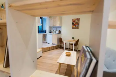 a view of a living room and kitchen from inside a house at Stylish and cosy Gem, top center! in Sofia