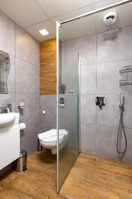 a bathroom with a shower with a toilet and a sink at Maritsa 1BD Apartment by Flat Manager in Plovdiv